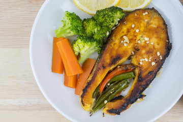 Grilled Salmon with fresh salad and lemon. Selective focus