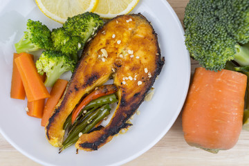 Grilled Salmon with fresh salad and lemon. Selective focus