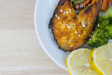 Grilled Salmon with fresh salad and lemon. Selective focus