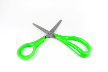 Green scissors isolated on a white background.