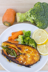 Grilled Salmon with fresh salad and lemon. Selective focus
