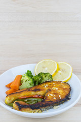 Grilled Salmon with fresh salad and lemon. Selective focus