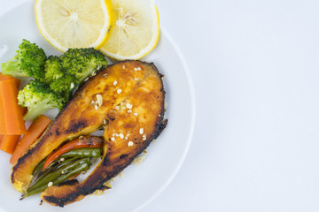 Grilled Salmon with fresh salad and lemon. Selective focus