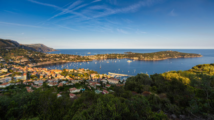 Villefranche-sur-Mer, Saint-Jean-Cap-Ferrat and the Espalmador Bay with yachts and tourist boats in Summer at sunset. French Riviera, Alpes Maritimes, Provence-Alpes-Cote-d'Azur, France