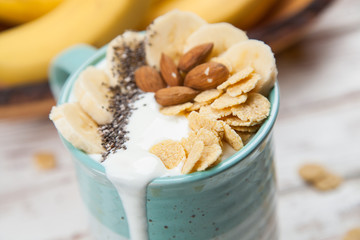 Banana yoghurt with seeds and cornflakes