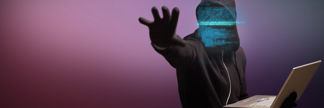 Composite image of hacker holding laptop while gesturing