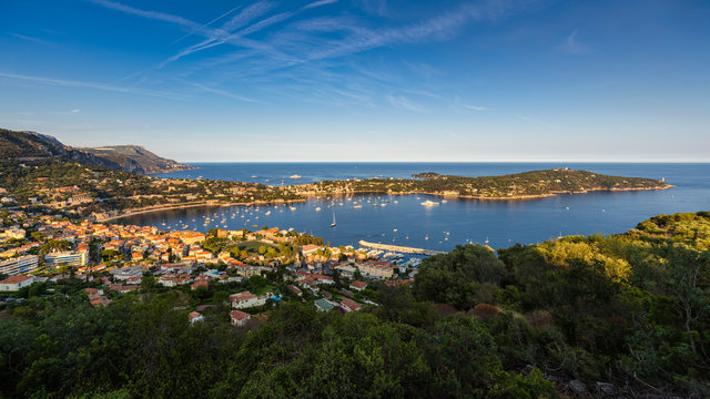 Fototapeta Villefranche-sur-Mer, Saint-Jean-Cap-Ferrat and the Espalmador Bay with yachts and tourist boats in Summer at sunset. French Riviera, Alpes Maritimes, Provence-Alpes-Cote-d'Azur, France
