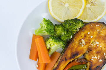 Grilled Salmon with fresh salad and lemon. Selective focus