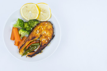 Grilled Salmon with fresh salad and lemon. Selective focus