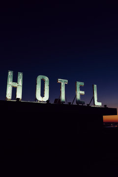 Old hotel sign on a roof