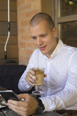 He reads the message and darts the coffee