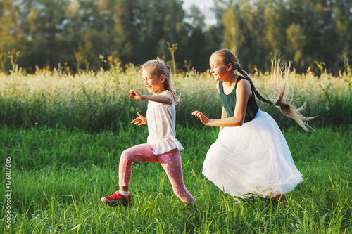 Two girls playing with each other Two girls playing with each other