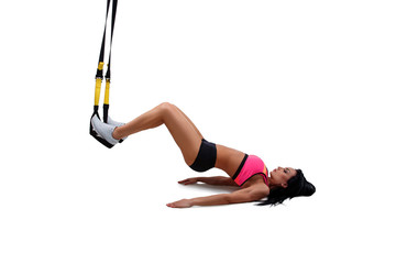 Fototapeta na wymiar Woman exercising with suspension straps