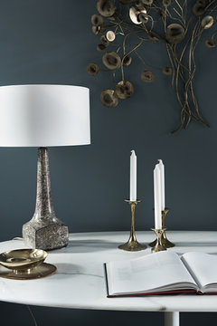 interior of table with lamp and candlesticks 