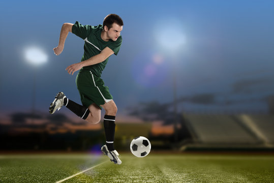 Soccer Player kicking the ball