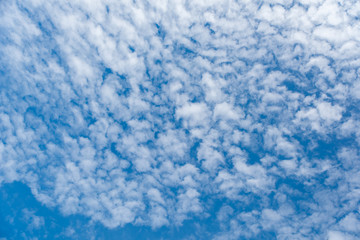 Fototapeta na wymiar Cirrostratus cloudscape or Fluffy cirrus clouds on blue blue sky, Beautiful cirrocumulus on the high altitude layer