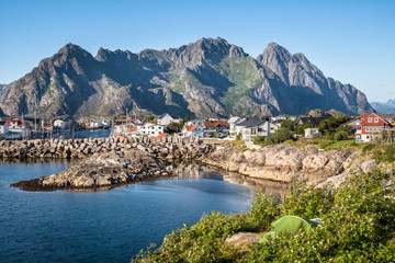 Fototapeta na wymiar Scenic view from idyllic village with mountains at bright summer day in Henningsvaer, Lofoten, Norway