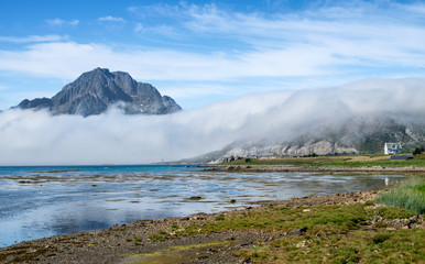 Scenic view from the beach with mountains against the blue sky in the Lofoten, Norway