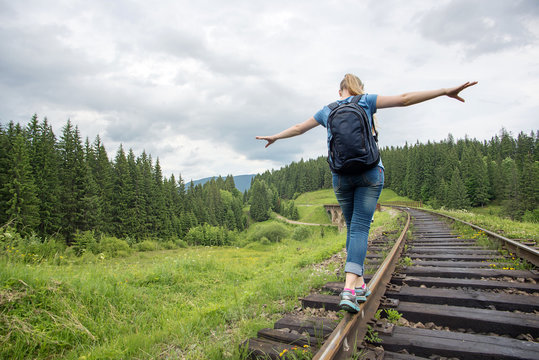 single woman travaler walk on railways