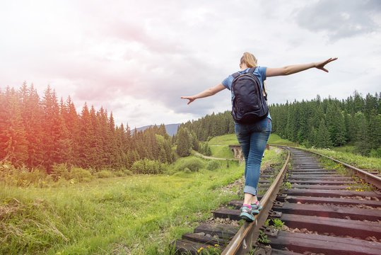single woman travaler walk on railways