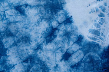 Pattern of blue dye on cotton cloth, Dyed indigo fabric background and textured