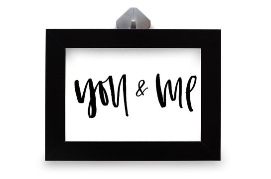 You and me. Handwritten text. Modern calligraphy. Inspirational quote. Black photo frame