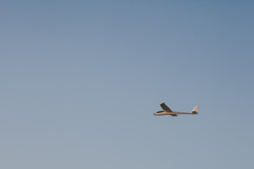 RC glider flying in the blue sky