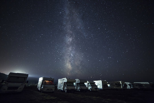 A tent on the lake beach under the milky way