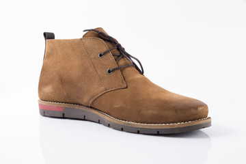 Male brown leather boot on white background, isolated product, comfortable footwear.