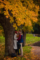 Beautiful pair of lovers walking in the autumn Park
