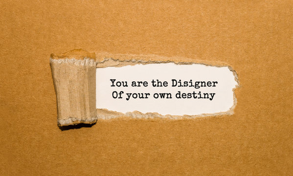 The text You are the Disigner Of your own destiny appearing behind torn brown paper