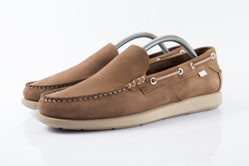 Male brown leather shoe on white background, isolated product, comfortable footwear.