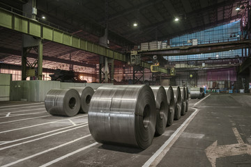 Raw steel coils ready for production in the steel mill