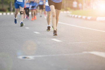 Group of people exercise race marathon in the city.