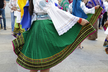 Woman dancing and wearing the traditional folk costume from Ecuador, South America