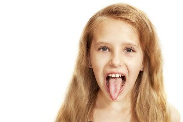 Young girl with long blonde hair at the doctor's reception shows a tongue