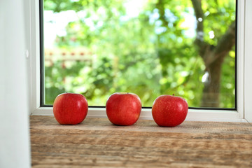Fresh apples on windowsill
