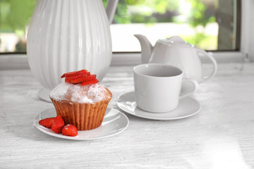 Delicious muffin on windowsill