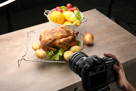 Woman taking photo of food with professional camera