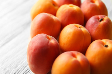 Fresh apricots on wooden table