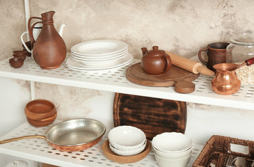 Fototapeta na wymiar Storage stand with kitchenware, indoors