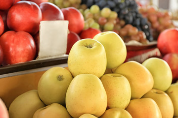 Delicious apples on counter at market, closeup