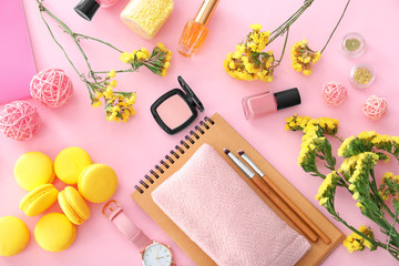 Composition with cosmetics, accessories and flowers on color background. Beauty blogger concept