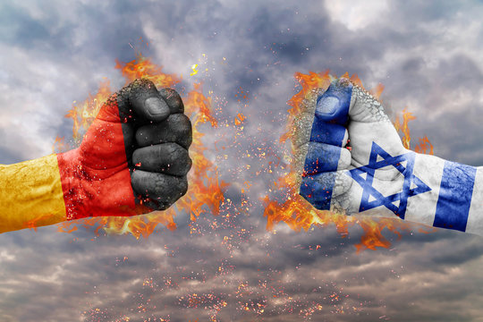 Two fist with the flag of Germany and Israel faced at each other ready for fight