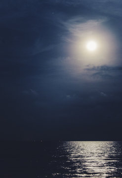 Full moon with the reflected light on the sea surface Stock Photo | Adobe  Stock