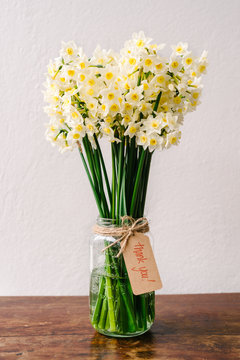 jonquil flowers in a glass vase with a simple note attached reading "thank you""onquil flo	Gillian	3				4