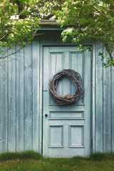Old blue barn door with wreath