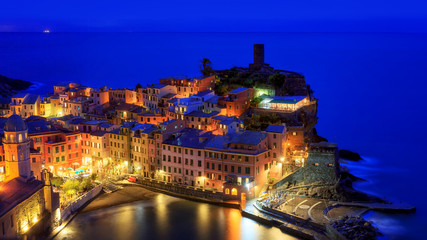 Fototapeta na wymiar Vernazza at dusk, in the classic blue light after sunset.