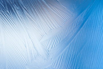Frozen glass. Abstract winter ice pattern on frozen window.