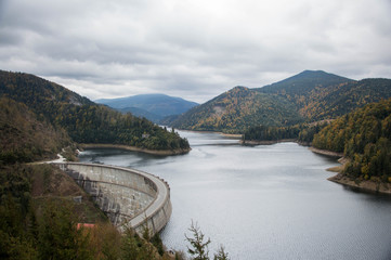 Fototapeta na wymiar Transylvanian mountain lake with a dam